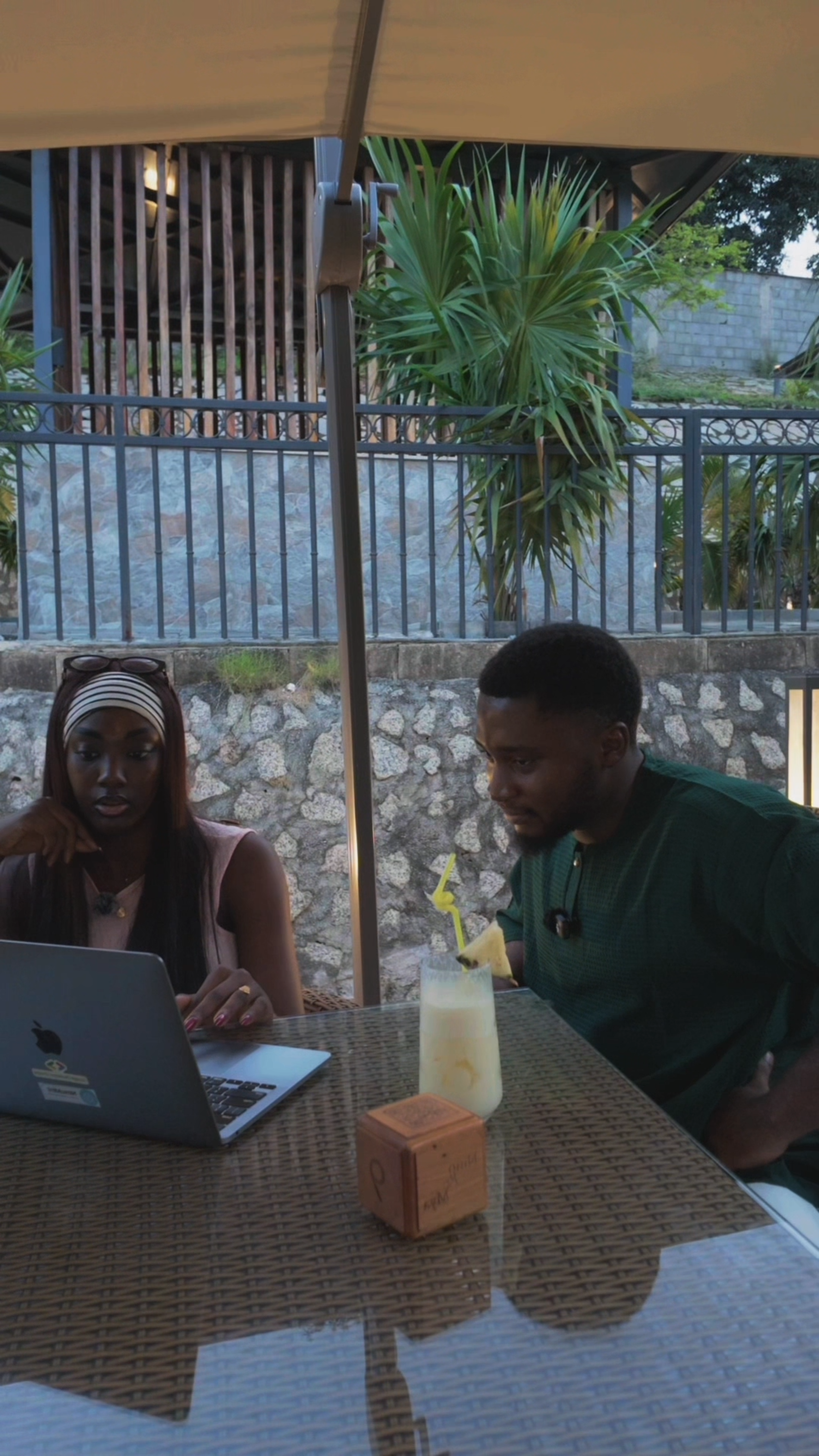 Ademi and Vincent Jande at a laptop